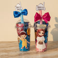 Two tumbler cups with cartoon characters and 'Happy Eid Mubarak' signs on a white background.
