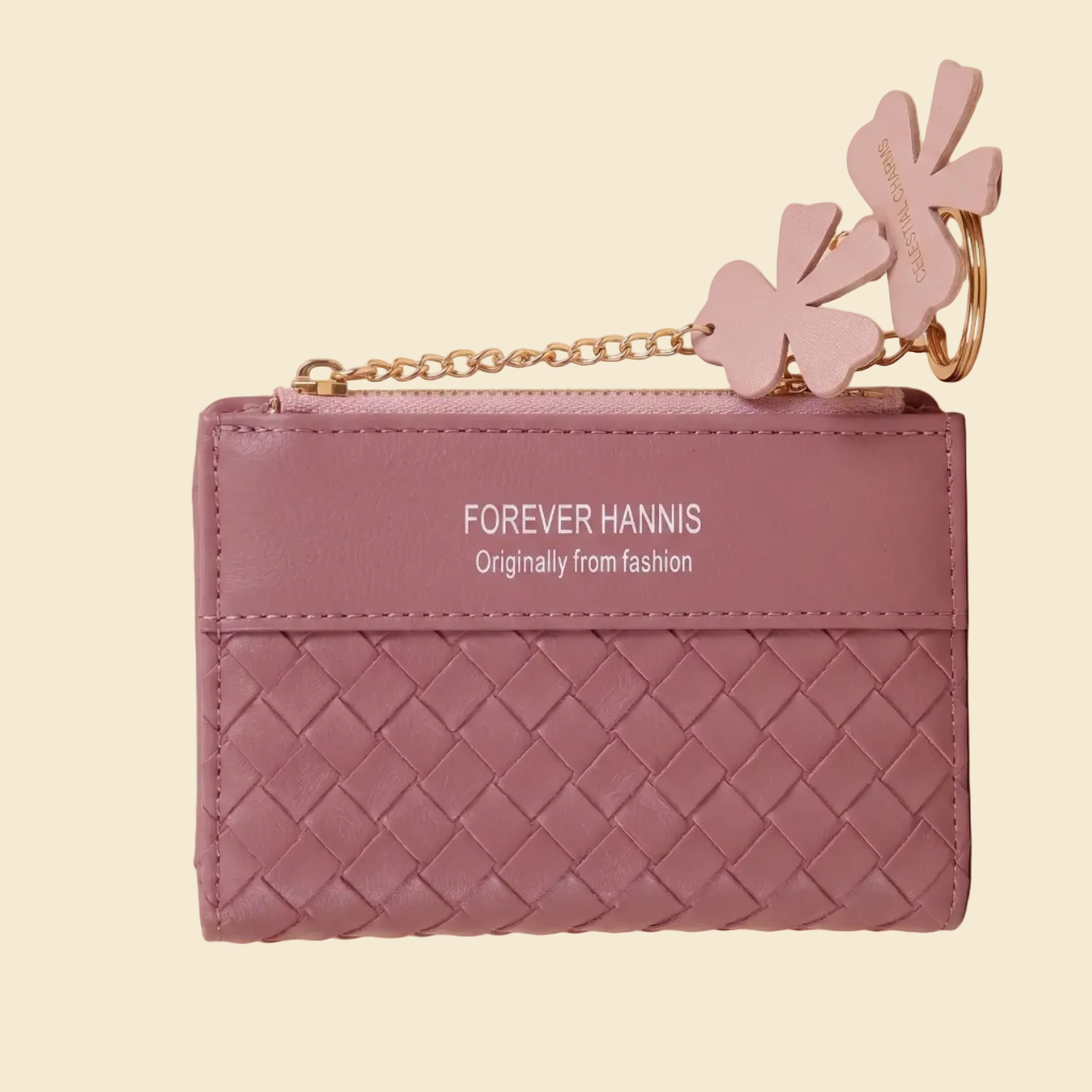 Pink woven wallet with floral keychain on a beige background