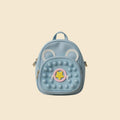 Light blue backpack with animal ears and a star design on a beige background
