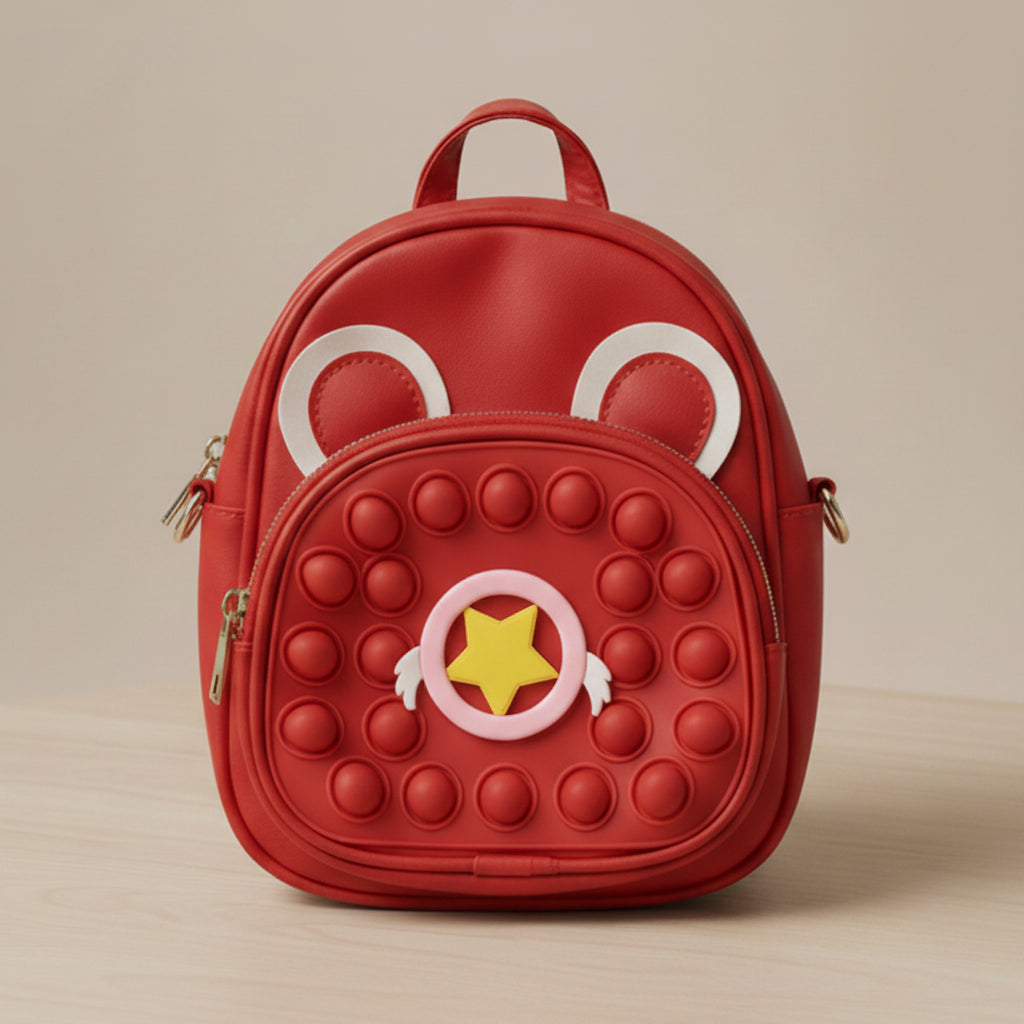 Red backpack with bubble texture and cartoon face design on a beige background